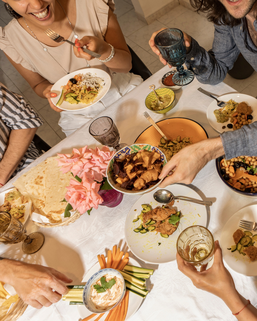 Top View of Friends Eating Vegan Food